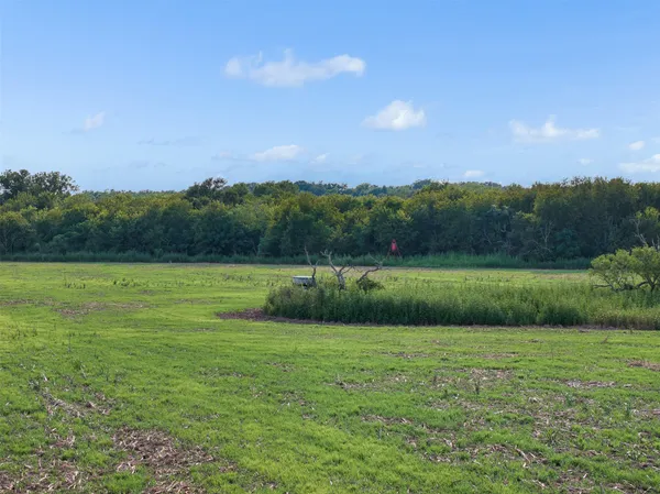 a view of a golf course with a lake