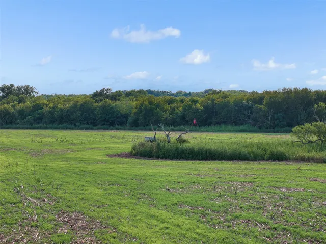 a view of a golf course with a lake