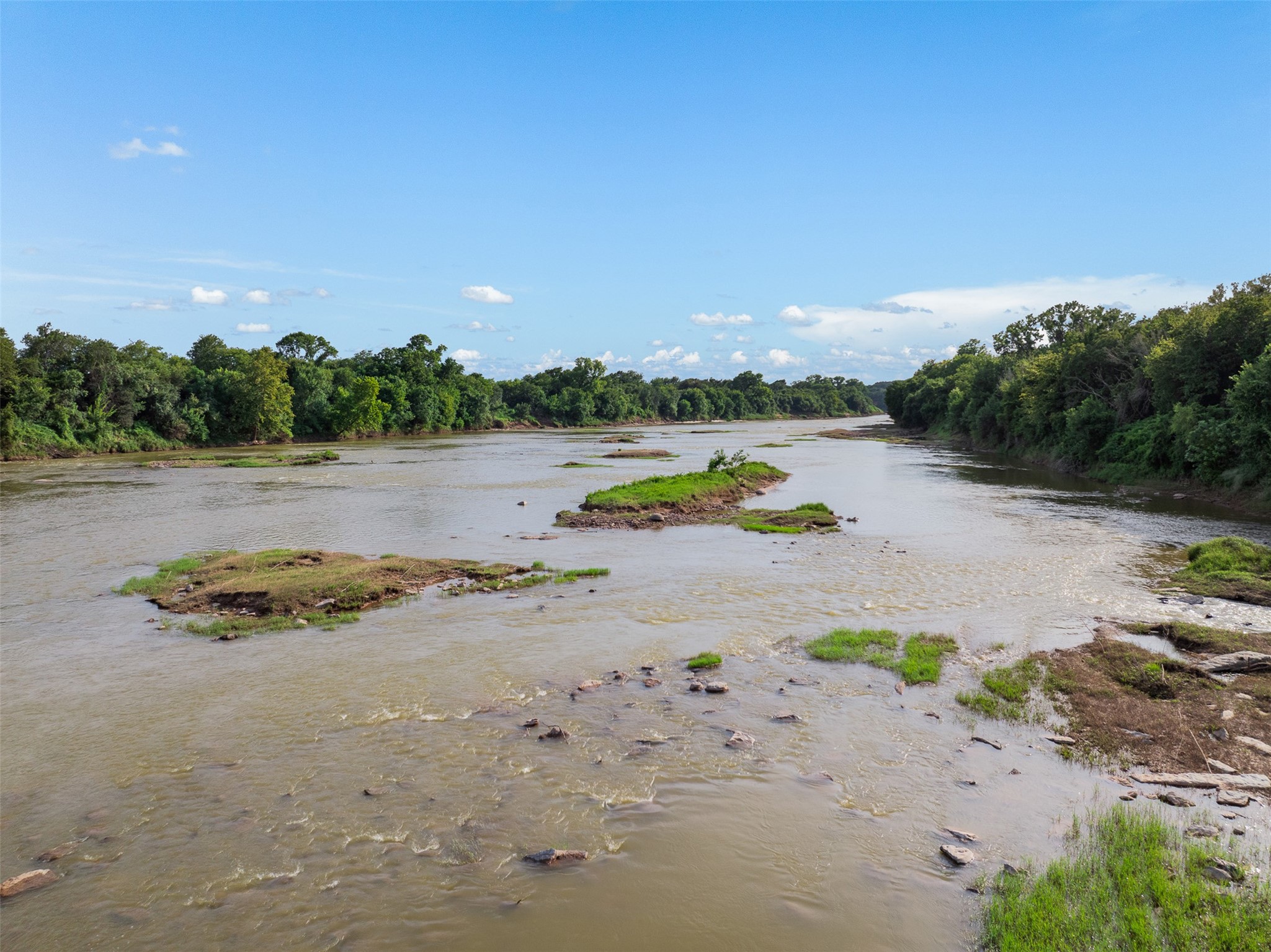 212-ac Black Bridge Road Calvert, TX 77837 - Photo 19 of 23 a view of a lake with beach and city view