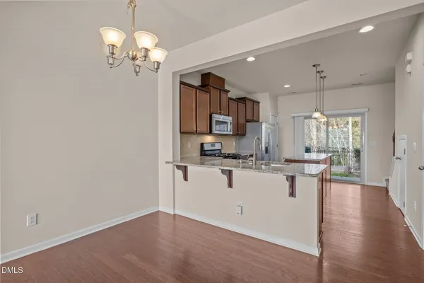 a view of kitchen with sink and microwave