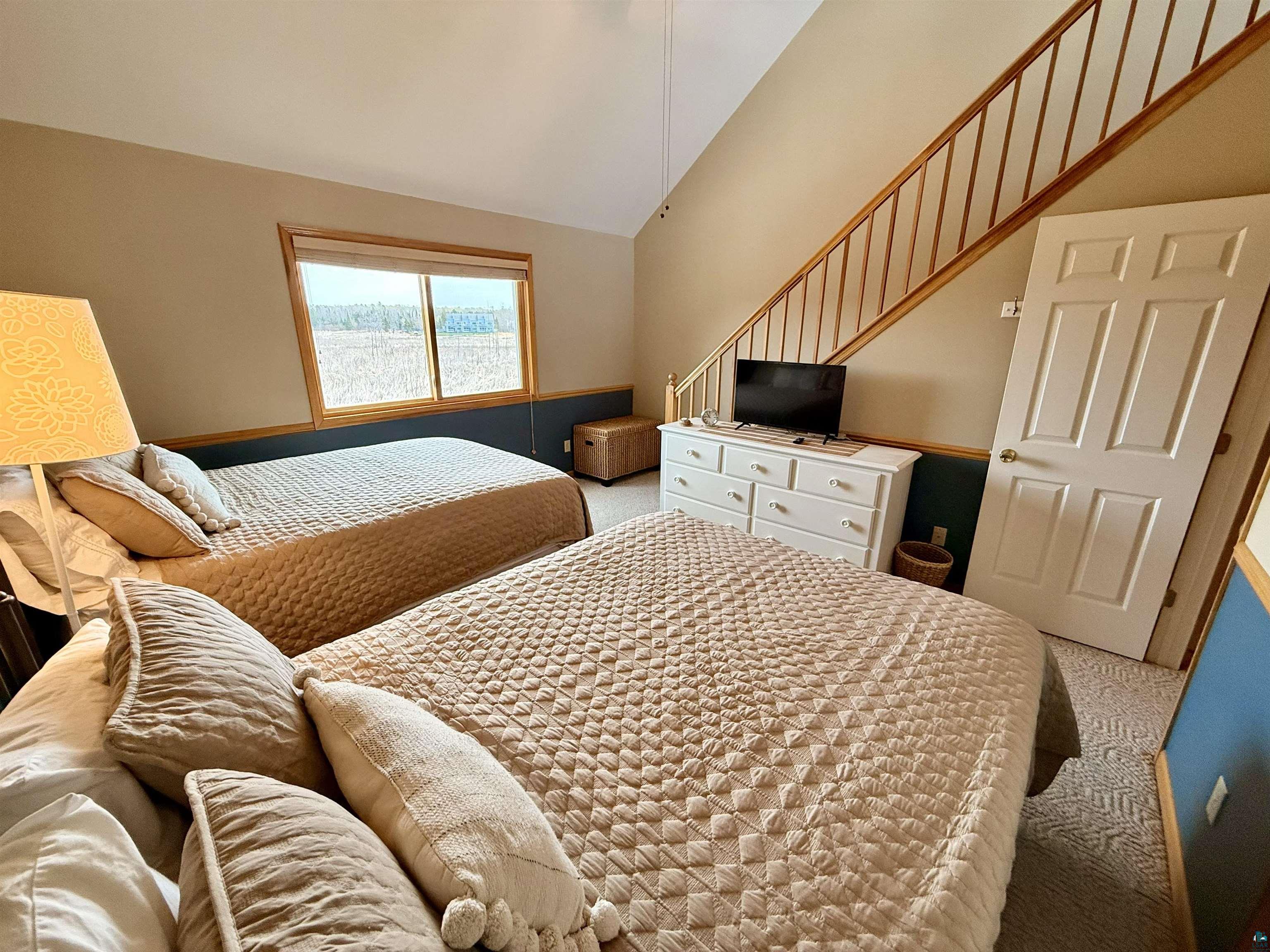 668 Fort Road, Unit 5 La Pointe, WI 54850 - Photo 12 of 27 views over the cattail marsh, spacious room with two queen beds