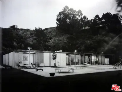 a view of a patio with table and chairs with wooden floor and fence