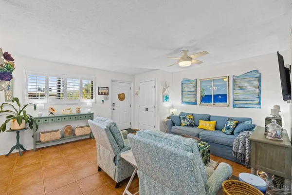 a living room with furniture and a couch