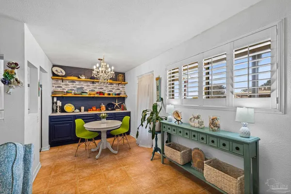 a view of a dining room with furniture window and outside view