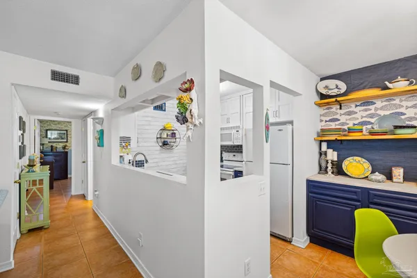 a hallway with washer and dryer