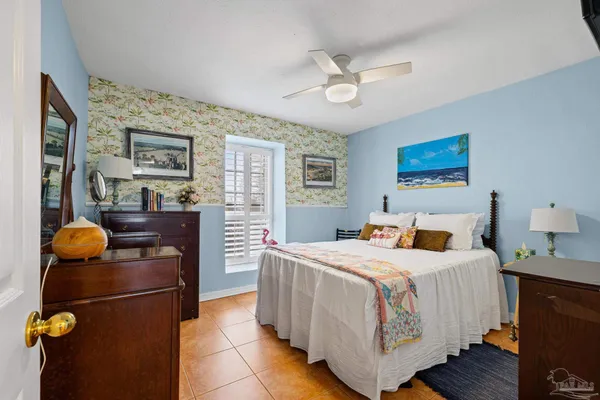 a bedroom with a bed and dresser