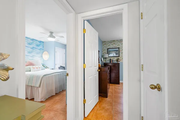 a view of a bedroom from a hallway