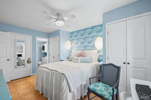 a bedroom with a bed and a couch