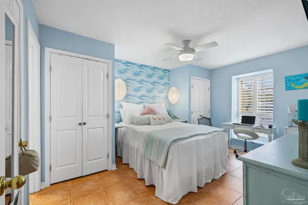 a bedroom with a bed and a table