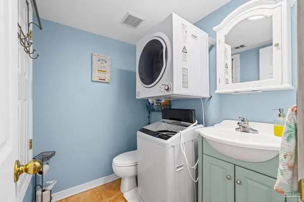 a bathroom with a sink a toilet and a vanity