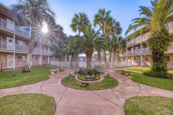 a view of a house with a yard and entertaining space
