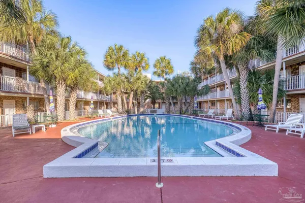 a view of a swimming pool with a patio