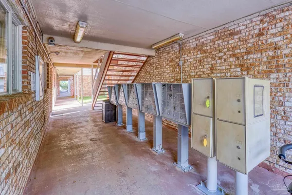 a view of a porch with wooden walls and stairs