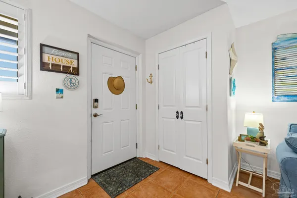 a view of kitchen with furniture and wooden floor