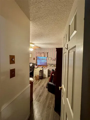 a living room with lots of furniture and clutter