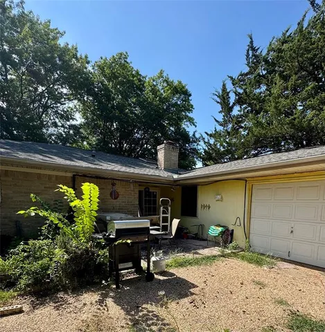 a view of car parked on the side of a street