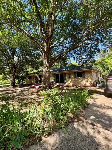 a bedroom with a bed and a mirror