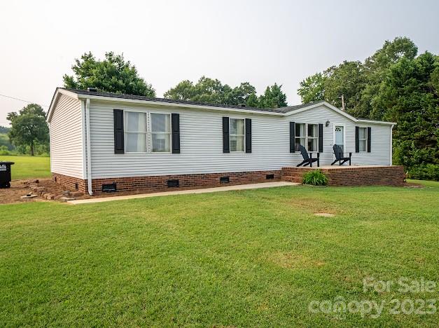 8331 Hills-View Road Oakboro, NC 28129 - Photo 2 of 34 a front view of house with yard and green space