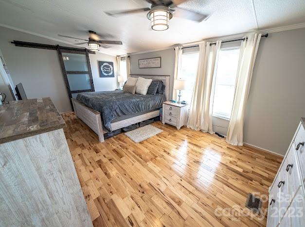 8331 Hills-View Road Oakboro, NC 28129 - Photo 23 of 34 a bedroom with a bed and window