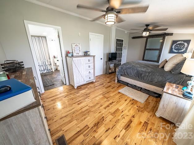 8331 Hills-View Road Oakboro, NC 28129 - Photo 24 of 34 a bedroom with a bed dresser and a large mirror