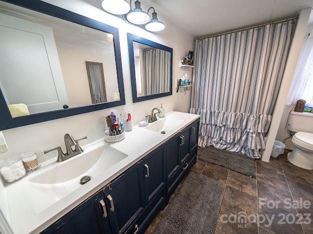 8331 Hills-View Road Oakboro, NC 28129 - Photo 25 of 34 a spacious bathroom with a double vanity sink and a mirror