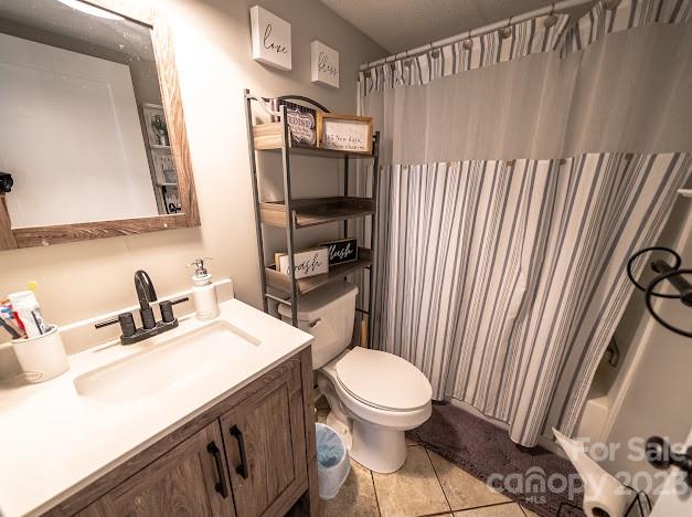 8331 Hills-View Road Oakboro, NC 28129 - Photo 28 of 34 a bathroom with a sink a toilet and shower curtain