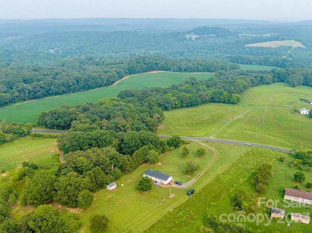 8331 Hills-View Road Oakboro, NC 28129 - Photo 30 of 34 a view of a big yard with large trees