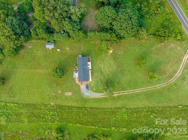 8331 Hills-View Road Oakboro, NC 28129 - Photo 34 of 34 a view of a green yard with large trees