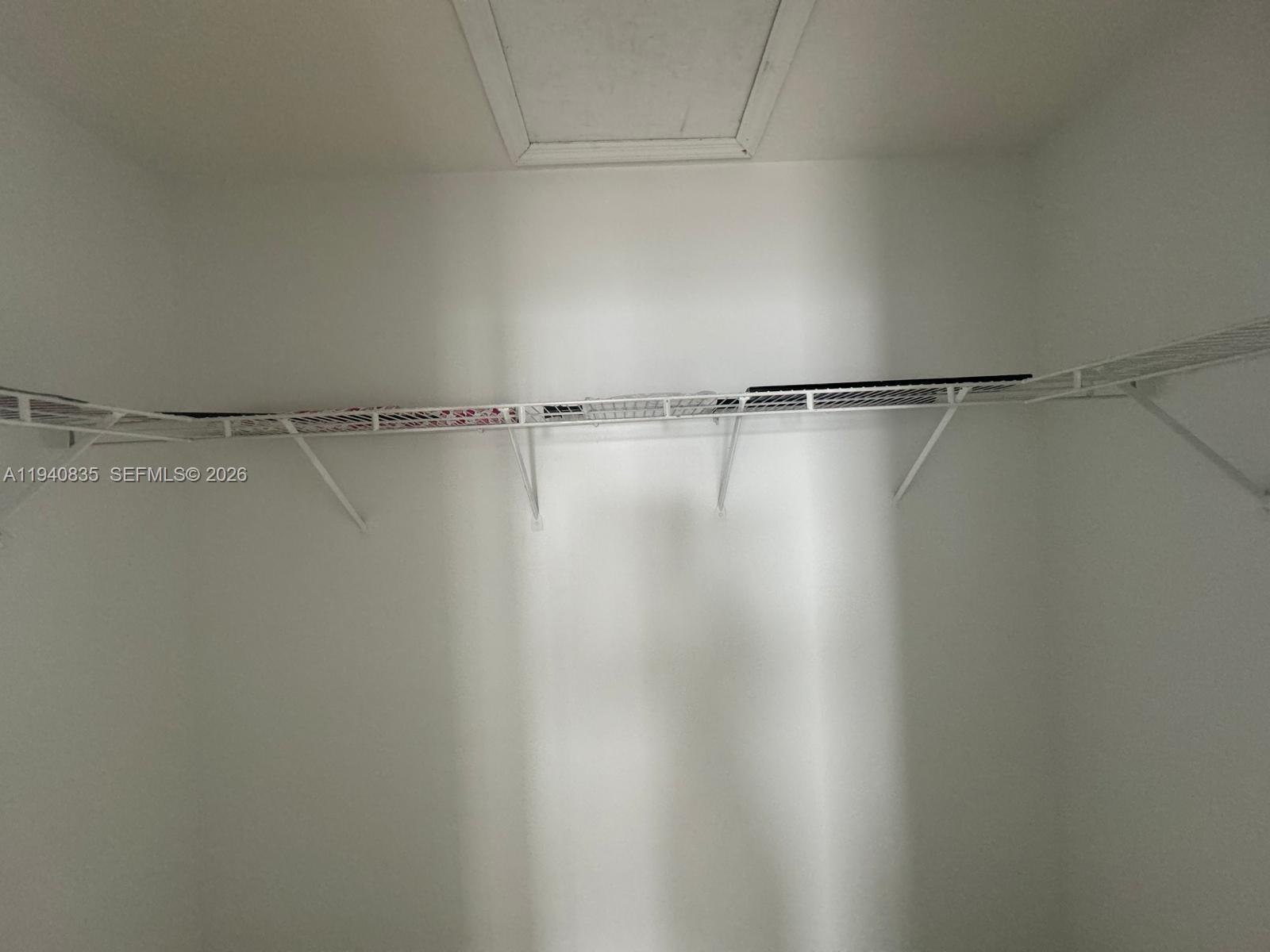 12601 Southwest 223rd Street Miami, FL 33170 - Photo 11 of 11 a view of a room with racks on the wall