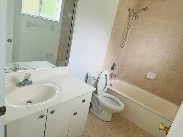 a bathroom with a sink a toilet and a bathtub