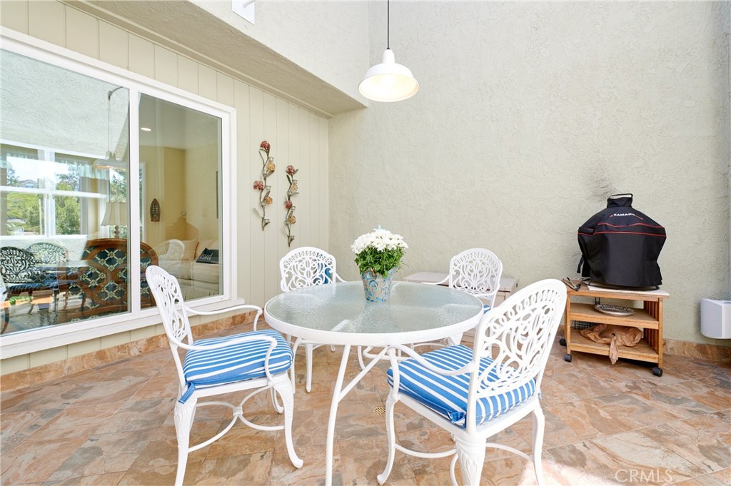 4 Lucerne, Unit 22 Newport Beach, CA 92660 - Photo 13 of 23 a dining room with furniture and window