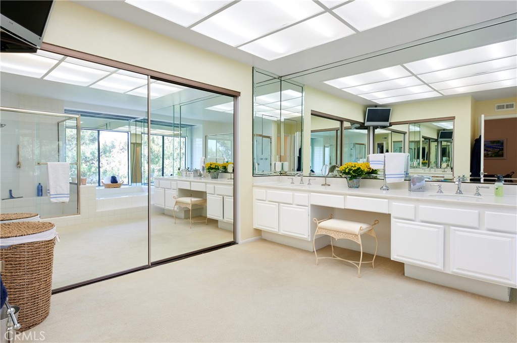4 Lucerne, Unit 22 Newport Beach, CA 92660 - Photo 17 of 23 a dining hall with stainless steel appliances kitchen island a large window and white cabinets