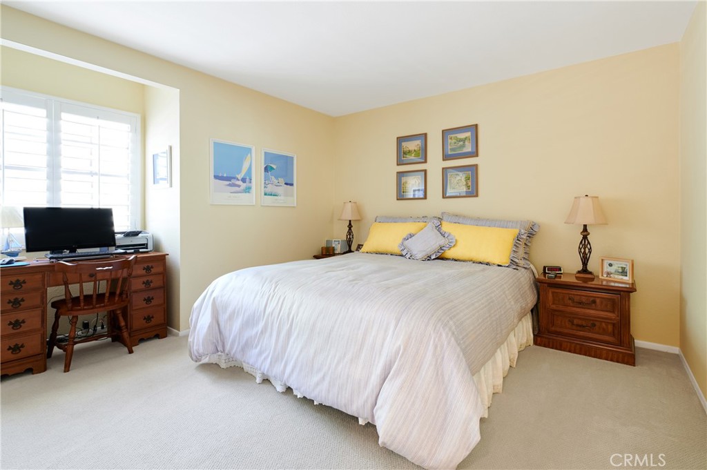 4 Lucerne, Unit 22 Newport Beach, CA 92660 - Photo 19 of 23 a bedroom with a bed and furniture