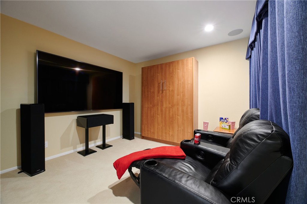 4 Lucerne, Unit 22 Newport Beach, CA 92660 - Photo 20 of 23 a living room with furniture and a flat screen tv