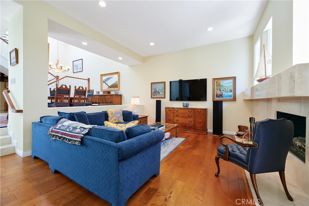 4 Lucerne, Unit 22 Newport Beach, CA 92660 - Photo 2 of 23 a living room with furniture and a flat screen tv