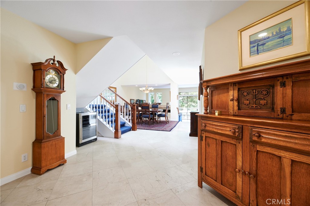 4 Lucerne, Unit 22 Newport Beach, CA 92660 - Photo 7 of 23 a view of a livingroom with furniture and a hallway