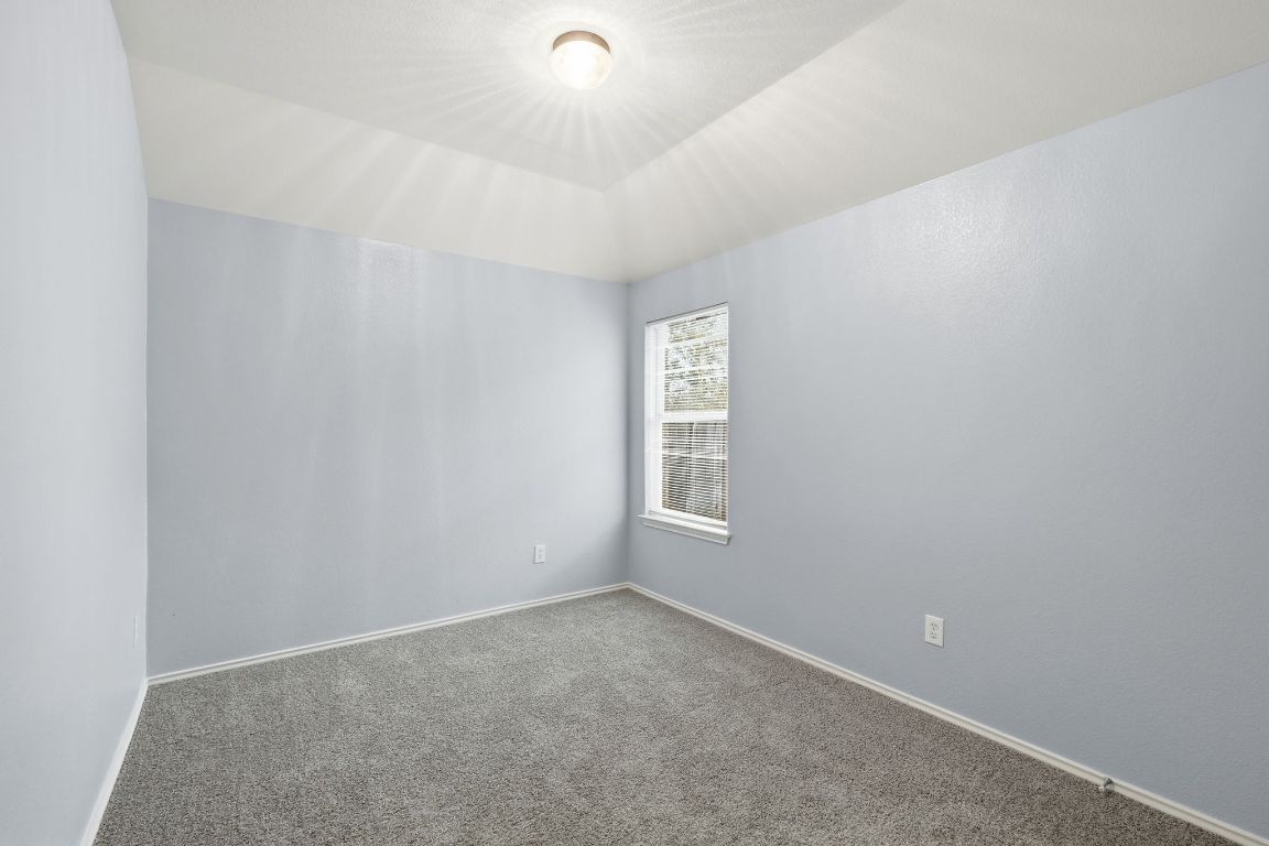 1910 Rachel Lane Round Rock, TX 78664 - Photo 14 of 17 a view of an empty room with a window