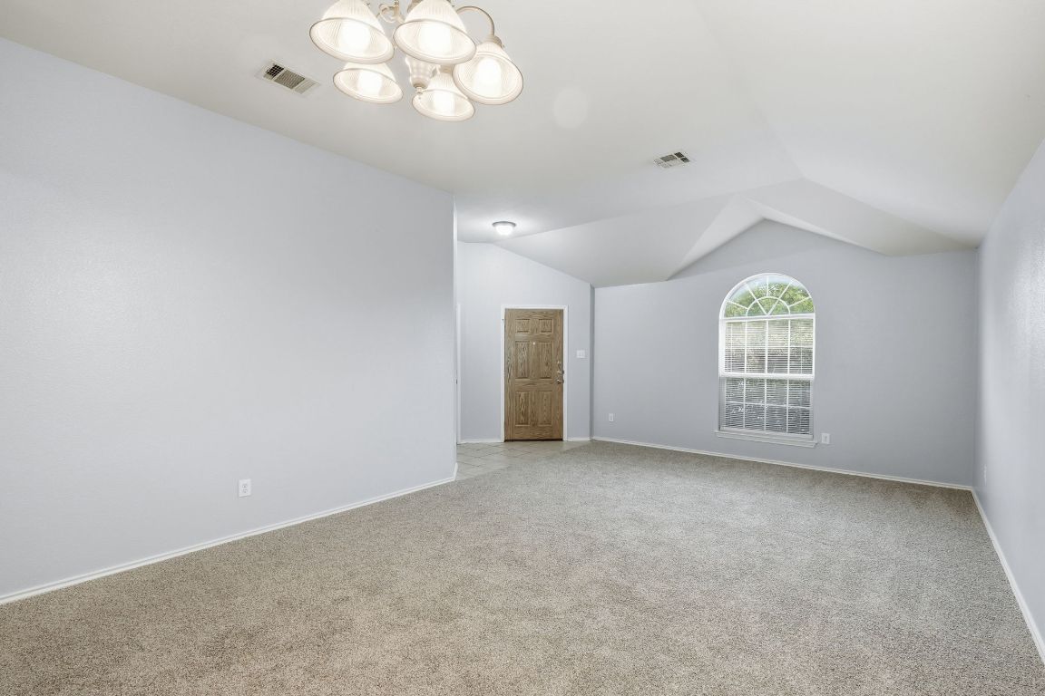 1910 Rachel Lane Round Rock, TX 78664 - Photo 3 of 17 an empty room with windows and entrance