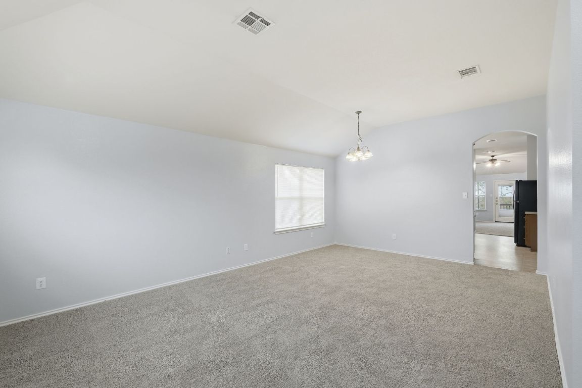 1910 Rachel Lane Round Rock, TX 78664 - Photo 4 of 17 an empty room with windows and cabinet