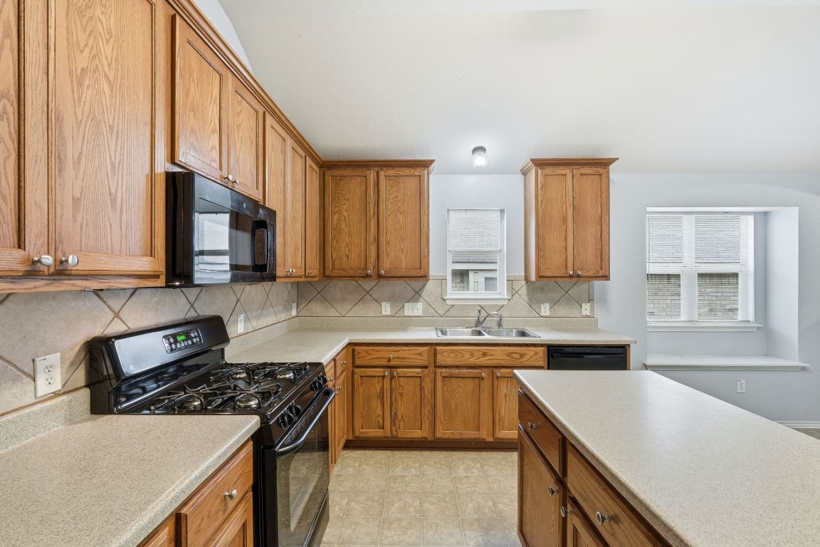 1910 Rachel Lane Round Rock, TX 78664 - Photo 6 of 17 a kitchen with a sink stove and cabinets