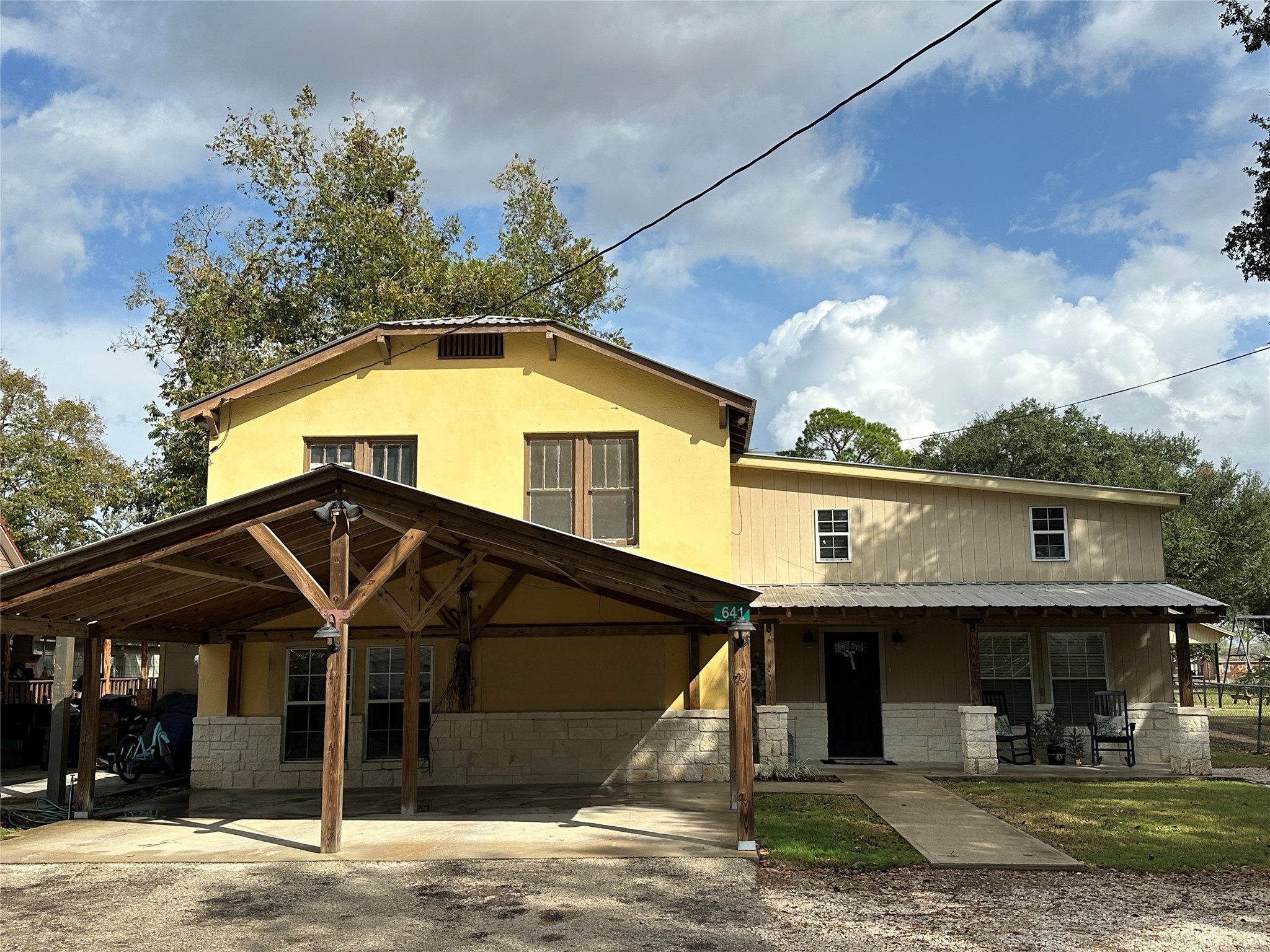 641 Baxter Street Garwood, TX 77442 - Photo 1 of 33 a front view of a house with a porch