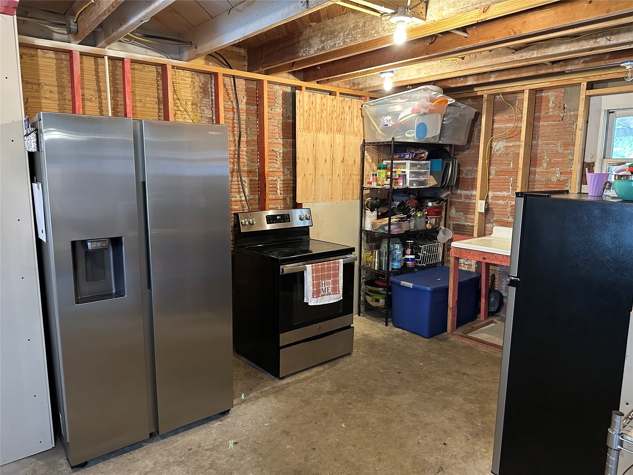641 Baxter Street Garwood, TX 77442 - Photo 13 of 33 a kitchen with stainless steel appliances granite countertop a refrigerator and a stove