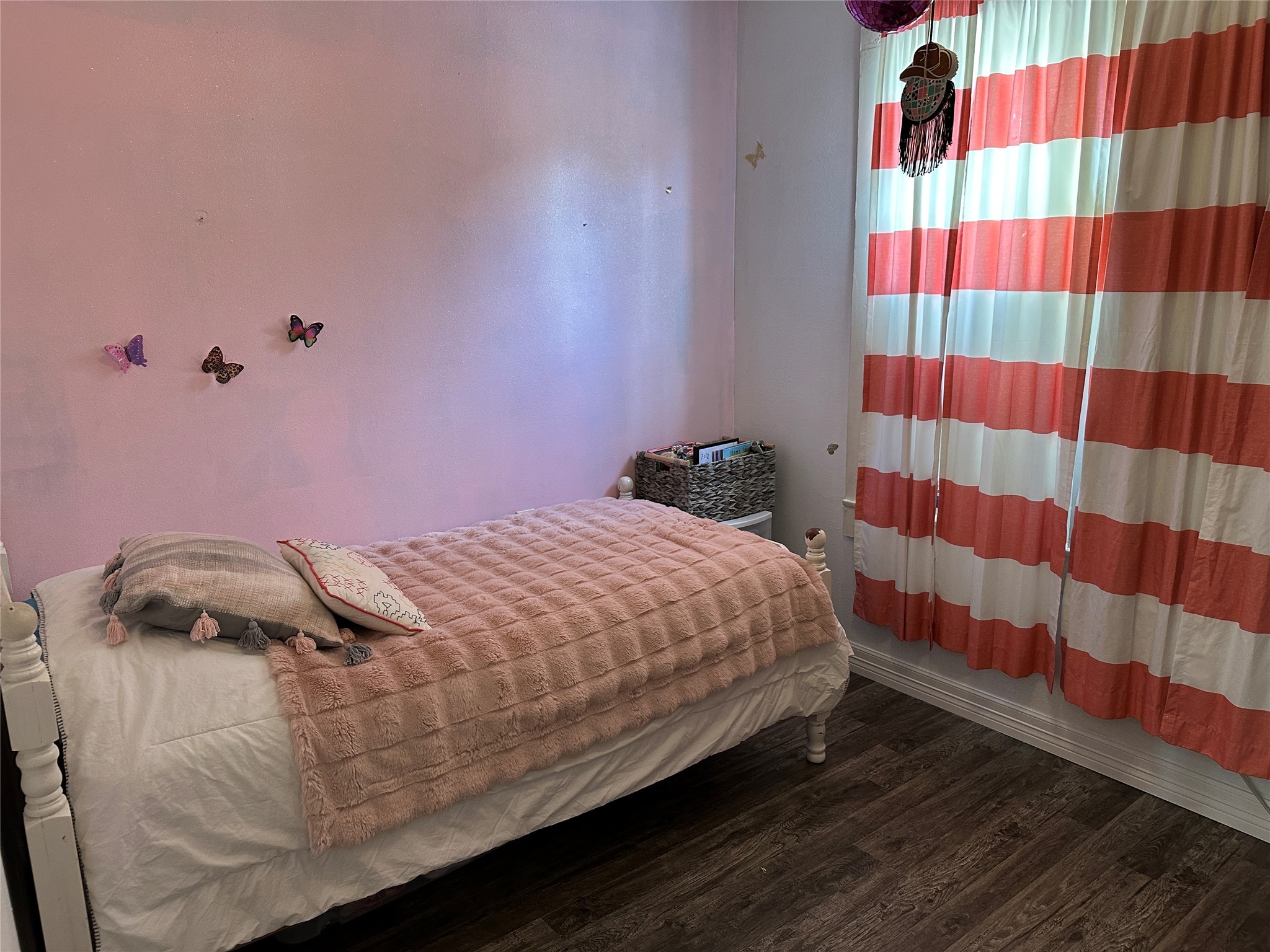 641 Baxter Street Garwood, TX 77442 - Photo 21 of 33 a bedroom with a bed and a painting on the wall