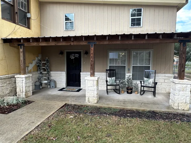 a view of a living room with chairs