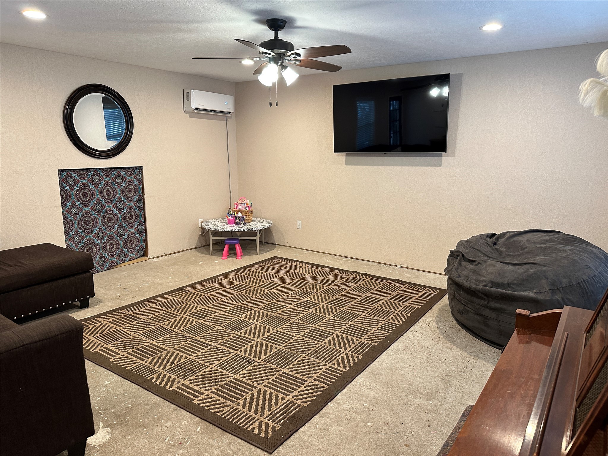 641 Baxter Street Garwood, TX 77442 - Photo 5 of 33 a bedroom with a bed and a flat screen tv