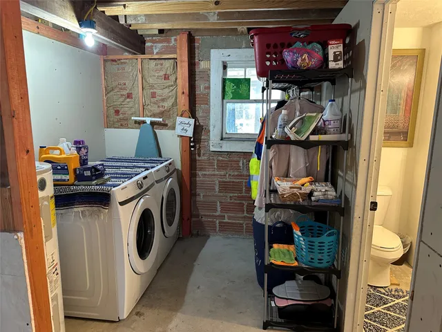 a utility room with dryer washer and a equipment