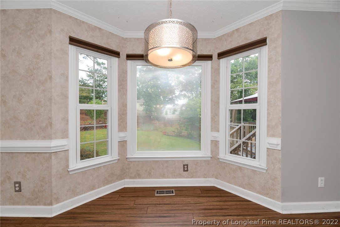338 Lionshead Road Fayetteville, NC 28311 - Photo 13 of 39 a view of an empty room with wooden floor and a window