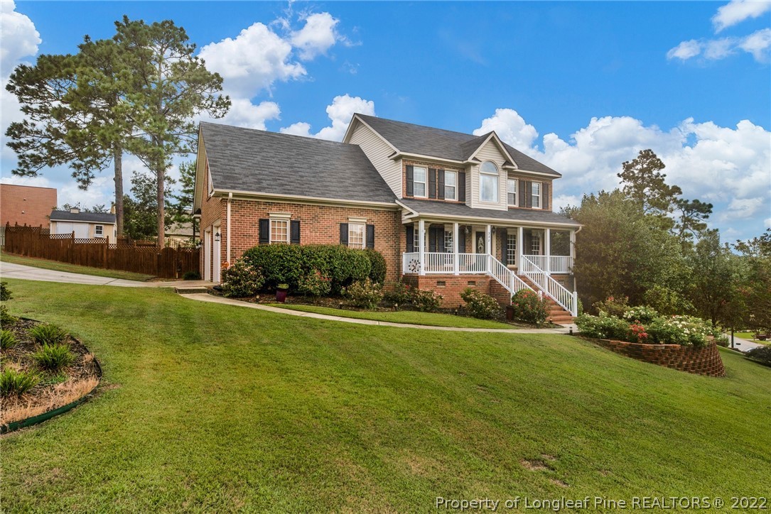 338 Lionshead Road Fayetteville, NC 28311 - Photo 2 of 39 a front view of a house with a garden