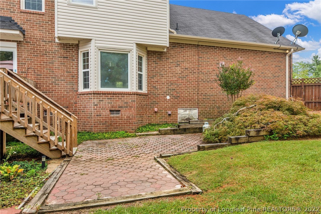 338 Lionshead Road Fayetteville, NC 28311 - Photo 35 of 39 a view of a backyard with potted plants