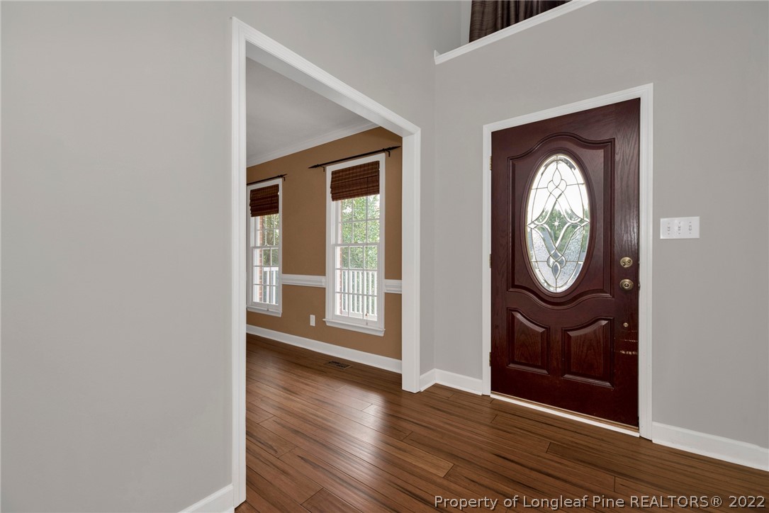 338 Lionshead Road Fayetteville, NC 28311 - Photo 6 of 39 a view of a hallway with wooden floor